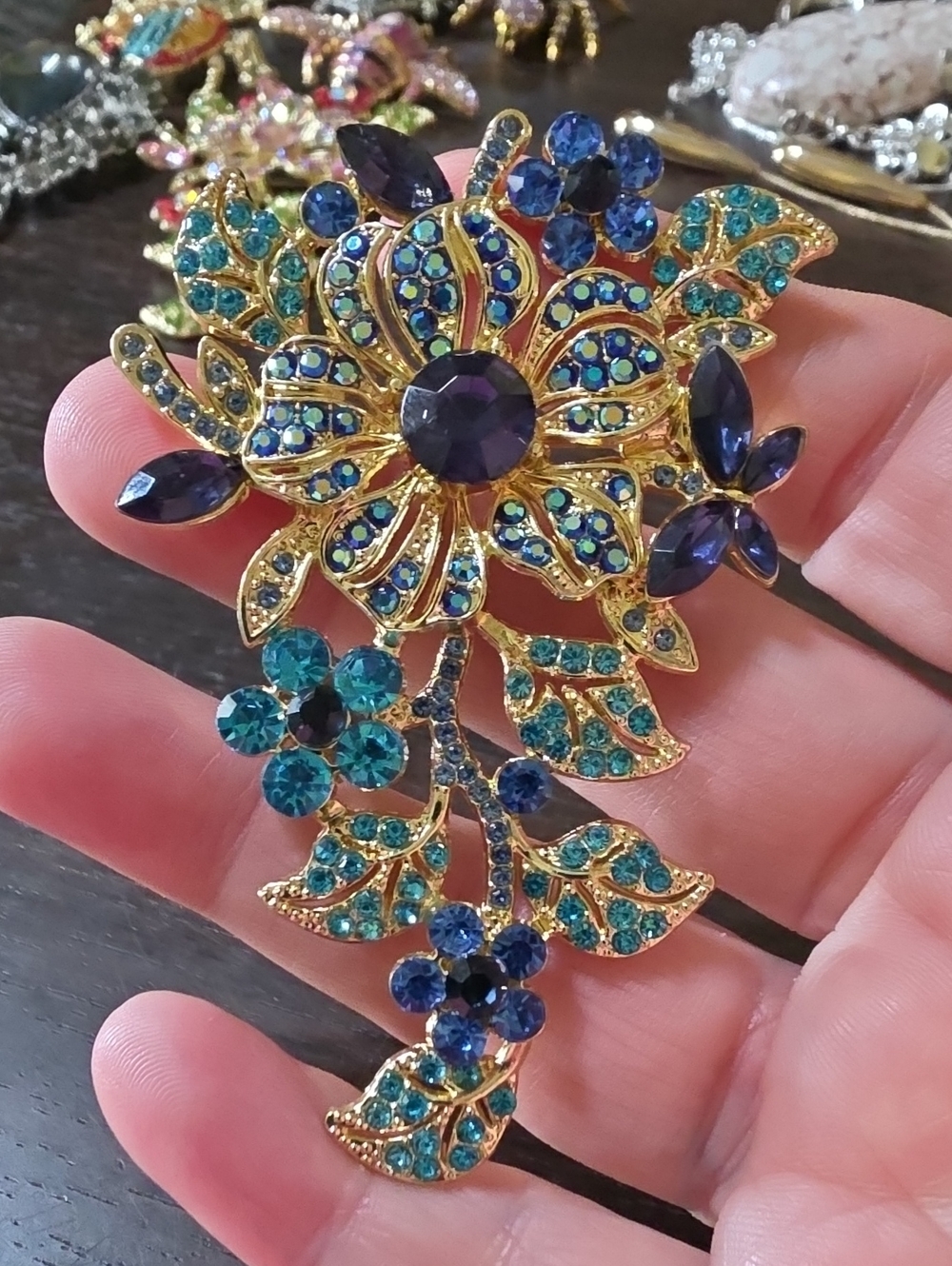 A145- Gold Floral Brooch with Blue and Teal Crystals